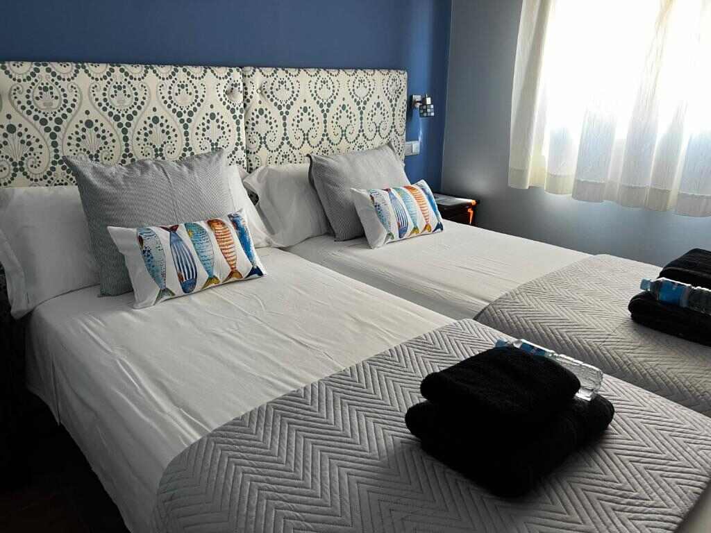 Bright twin room with sea-inspired decor